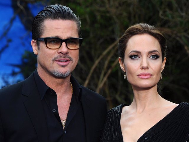 Brad Pitt and Angelina Jolie attend a private reception as costumes and props from Disney's "Maleficent" are exhibited in support of Great Ormond Street Hospital at Kensington Palace on May 8, 2014 in London, England.