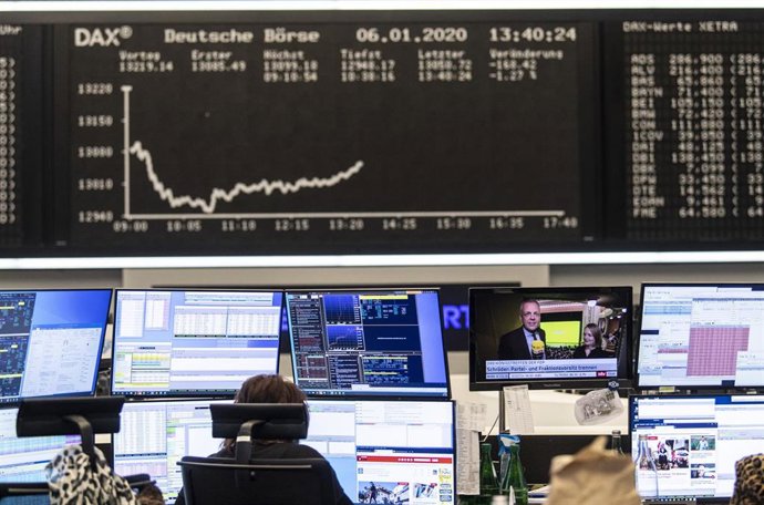 06 January 2020, Hessen, Frankfurt_Main: A stock trader works on the Frankfurt Stock Exchange, as the conflict between the USA and Iran has further unsettled investors in the German stock market. The Dax temporarily slipped below the 13,000 mark, a low 