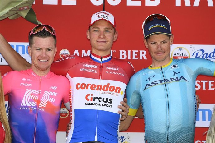 21 April 2019, Netherlands, Berg En Terblijt: Australian cyclist Simon Clarke of EF Education First Pro Cycling (L-R), Dutch cyclist Mathieu Van der Poel of Corendon-Circus and Danish cyclist Jakob Fuglsang of Astana Pro Team celebrate on the podium