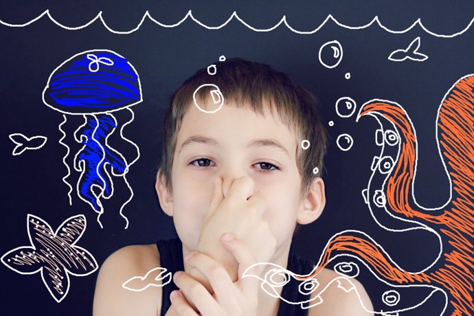 Young Boy Imagination Underwater    Young boy using imagination to pretend he is holding his breath underwater with octopus, fish, jellyfish, and starfish.