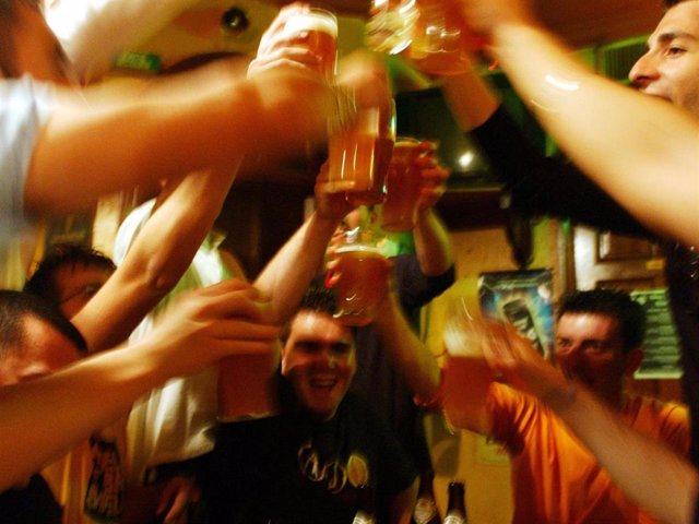 Italian students from the Primo Levi Technical Institute of Vignola in the Modena Province, toast with glasses of beer in a pub during a school trip to Strasbourg, France to visit the European Parliament on May 18, 2004.