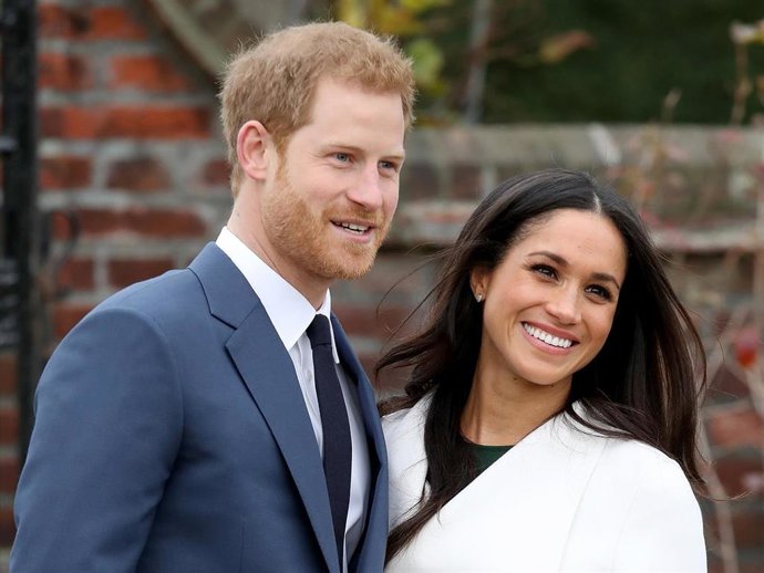 Prince Harry and actress Meghan Markle during an official photocall to announce their engagement at The Sunken Gardens at Kensington Palace on November 27, 2017 in London, England.