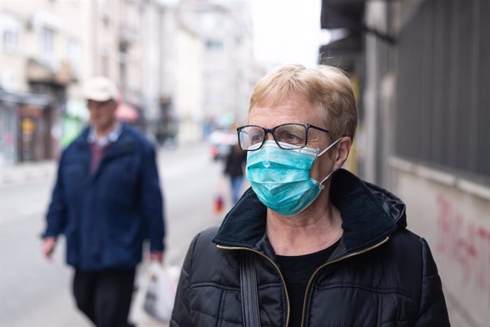 Mask against Coronavirus    Senior woman wearing mask to protect from Coronavirus
