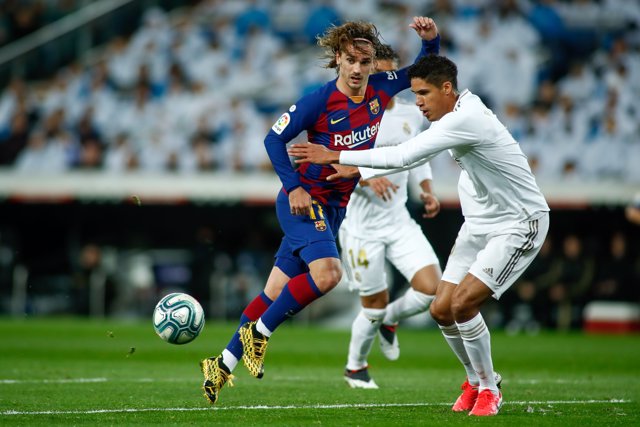Antoine Griezmann of FC Barcelona and Raphael Varane of Real Madrid in action during the Spanish League, La Liga, football match played between Real Madrid and FC Barcelona at Santiago Bernabeu stadium on March 01, 2020 in Madrid, Spain.