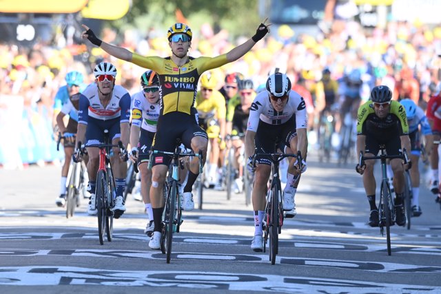 02 September 2020, France, Privas: Belgian cyclist Wout Van Aert of Team Jumbo-Visma celebrates as he crosses the finish line to win the 5th stage of the 107th edition of the Tour de France cycling race, 185 km from Gap to Privas