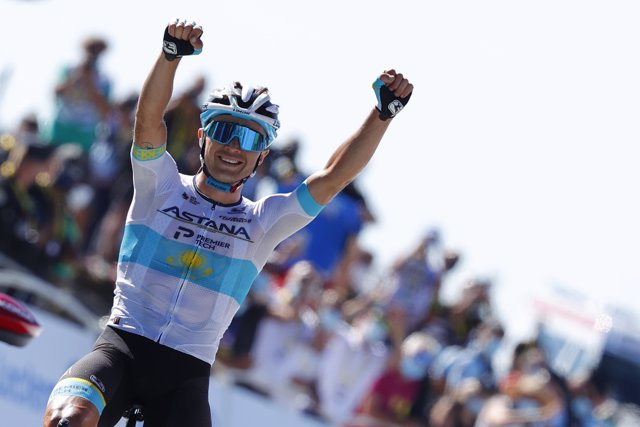 03 September 2020, France, Mont Aigoual: Kazakh cyclist Alexei Luzenko from Team Astana celebrates as he crosses the finish line to win the 6th stage of the 107th edition of the Tour de France cycling race, 191 km from Le Teil to Mont Aigoual.