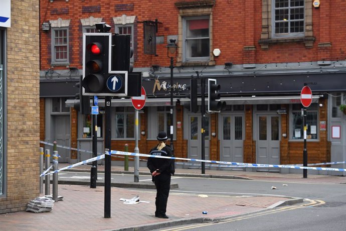 06 September 2020, England, Birmingham: A police officer is seen at a cordon at Irving Street in Birmingham after a number of people were stabbed in the city centre.
