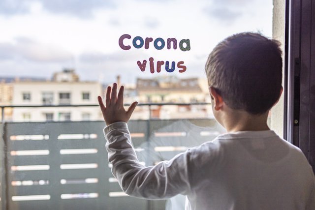 Little boy in confinement for the Coronavirus pandemic Little boy in confinement for the Coronavirus pandemic