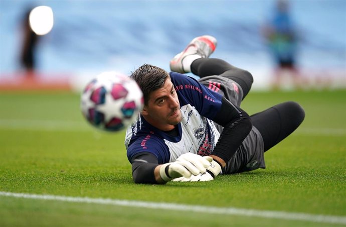 Real Madrid goalkeeper Thibaut Courtois warms up prior to the start of the UEFA Champions League round of 16 second leg soccer match between Manchester City and Real Madrid at the Etihad Stadium.