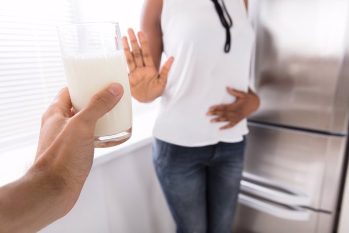 Woman Rejecting Glass Of Milk