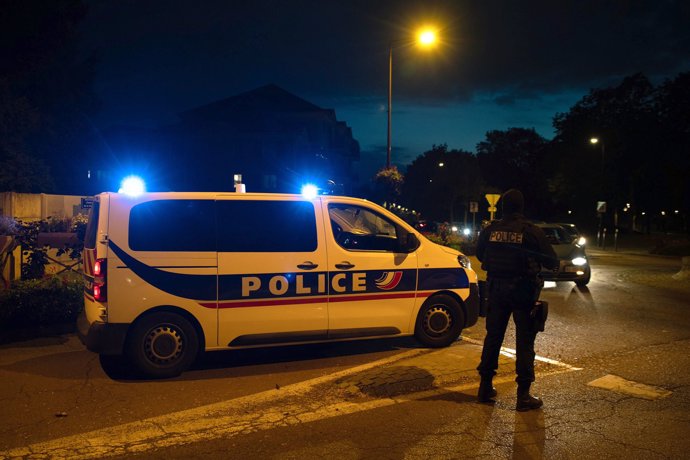 16 October 2020, France, Eragny: Police officers investigate a crime scene, where a a history teacher was decapitated by an assailant near Paris, Asuspect who was shot by police is dead. Photo: Abdulmonam Eassa/AFP/dpa