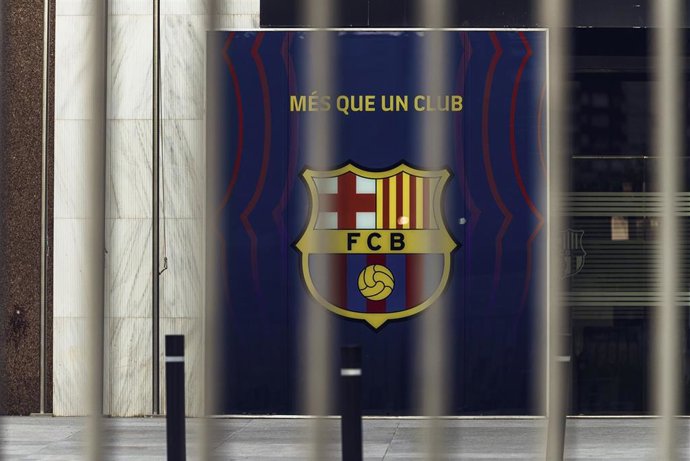 A general view of the Barcelona emblem behind the gates of the Camp Nou stadium near where fans gathered to protest against club president Josep Maria Bartomeu. Photo: Matthias Oesterle/dpa
