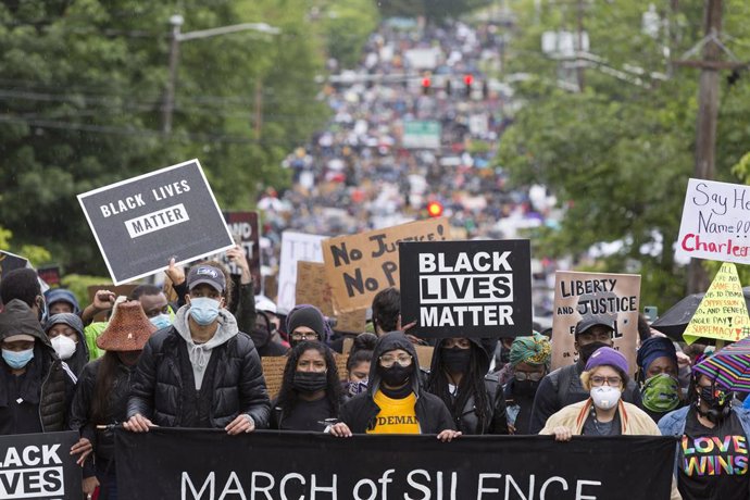 12 June 2020, US, Seattle: People take part in a silent march through Seattle's 