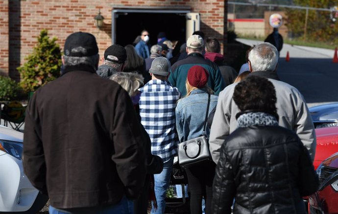 03 November 2020, US, York: People wait outside the Zion Lutheran Church polling station before voting during the US Presidential election. Photo: Miguel Juarez Lugo/ZUMA Wire/dpa