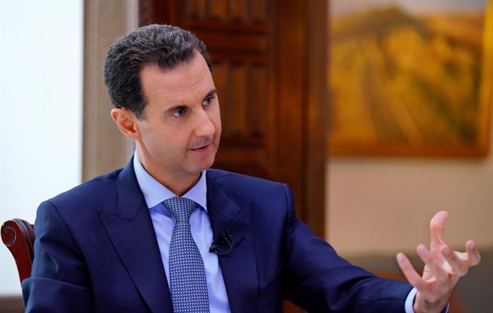 HANDOUT - 15 November 2019, Syria, Damaskus: The photo provided by the Syrian Arab News Agency (SANA) on 11/15/2019 shows Syrian President Bashar al-Assad speaking during a previously recorded television interview  with the RIA Novosti news agency and t
