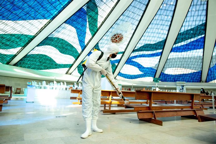 03 September 2020, Brazil, Brasília: Amember of the Brazilian army wearing  a full protective suit, disinfects Our Lady of Aparecida cathedral amid the Coronavirus (Covid-19) outbreak. Photo: Myke Sena/dpa