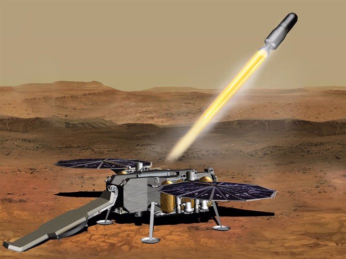 Esta ilustración muestra un concepto de cómo el Vehículo de Ascenso a Marte de la NASA, que transporta tubos que contienen muestras de roca y suelo, podría ser lanzado desde la superficie de Marte en un paso de la misión de retorno de muestras a Marte.