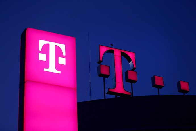 FILED - 13 February 2019, Bonn: The Deutsche Telekom logo shines on the roof of the company headquarters. German telecommunications giant Deutsche Telekom and software developer SAP said on Friday they had been asked by the European Commission to develo