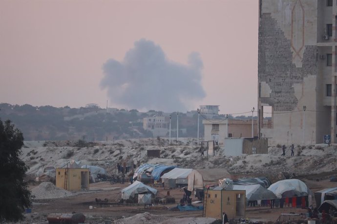 13 November 2020, Syria, Idlib: Smoke rises in the distance after airstrikes that believed to be mounted by Russian warplanes targeting the forest area. Photo: Omar Albam/SOPA Images via ZUMA Wire/dpa