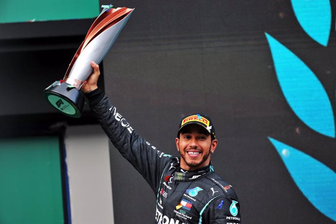 15 November 2020, Turkey, Istanbul: British Formula One driver of Mercedes AMG Petronas team, Lewis Hamilton, celebrates on the podium after winning the Turkish Grand Prix and securing his seventh world championship at Istanbul Park circuit. Photo: -/PA