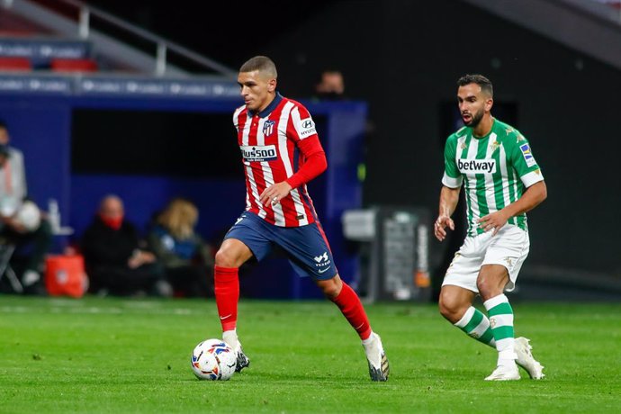 Lucas Torreira of Atletico de Madrid and Martin Montoya of Real Betis in action during the spanish league, La Liga, football match played between Atletico de Wanda Metropolitano stadium on October 24, 2020 in Madrid, Spain.