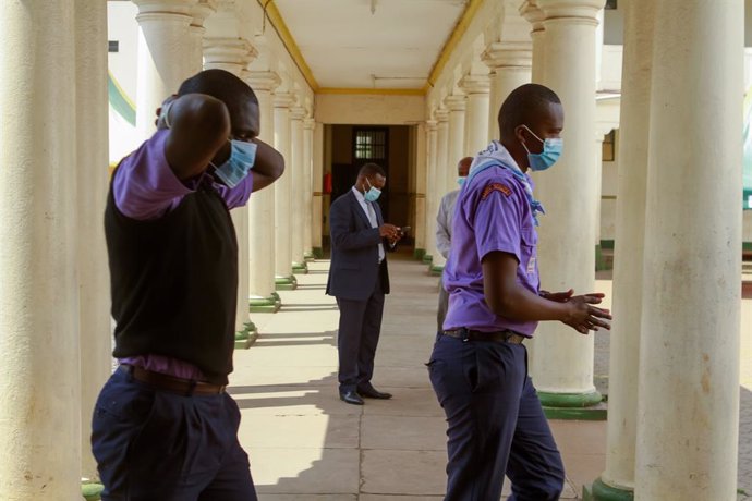 12 October 2020, Kenya, Nairobi: Students maintain social distance at Jamhuri Secondary school on the first day in school after the Kenyan government reopened schools having been closed since March due to the coronavirus (Covid-19) pandemic. Photo: Boni