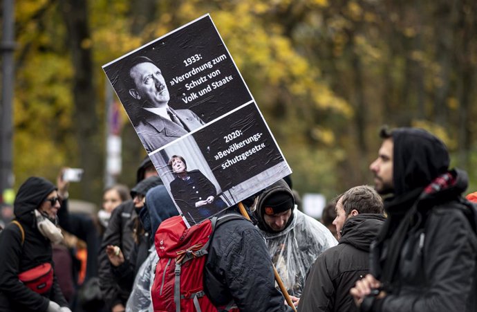 18 November 2020, Berlin: A protester takes part in a demonstration against the coronavirus restrictions adopted by the German and state governments and the adoption of the amendment to the Infection Protection Act by the German Bundestag. Photo: Fabian