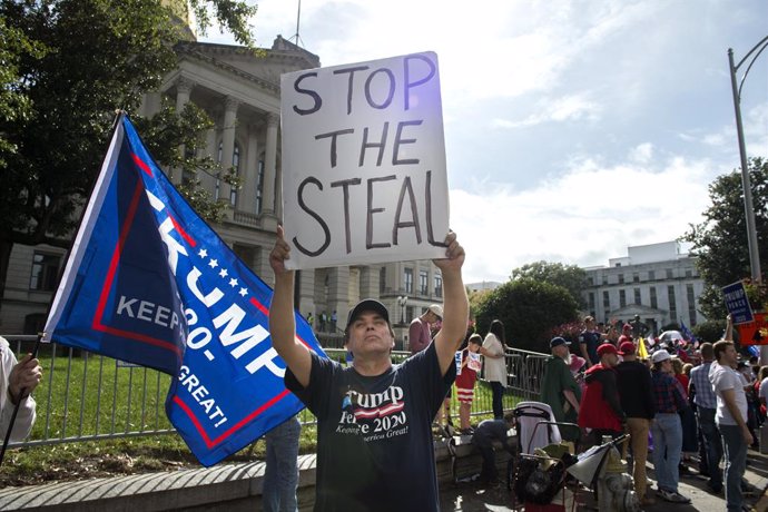 07 November 2020, US, Atlanta: Republican Trump supporters protest what they claim are illegal mail-in votes in Georgia election at "Stop the Steal" demonstration outside Georgia statehouse after former vice president Joe Biden has been projected to win