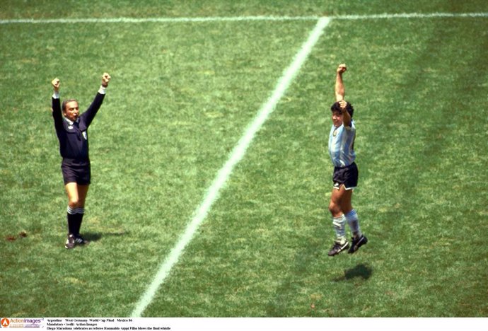 Diego Maradona of Argentina celebrates as referee Romualdo Arppi Filho blows the final whistle