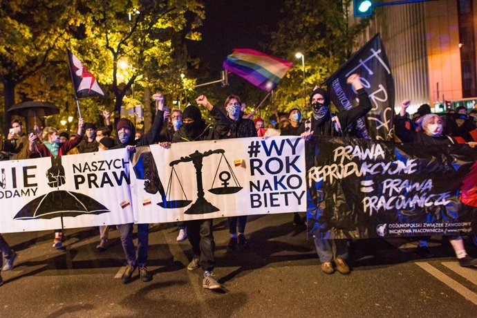 22 October 2020, Poland, Warsaw: Protesters hold a banner during an anti abortion demonstration. Photo: Attila Husejnow/SOPA Images via ZUMA Wire/dpa