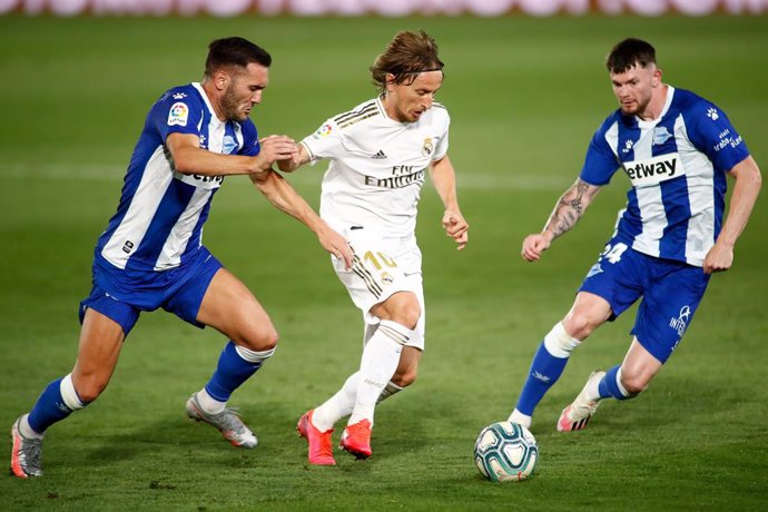 Luka Modric of Real Madrid and Lucas Perez of Alaves  in action during the Liga match between Real Madrid and Deportivo Alaves at Alfredo Di Stefano Stadium on July 10, 2020 in Valdebebas, Madrid, Spain.