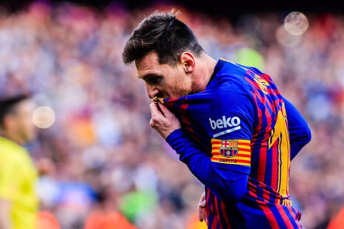 10 Leo Messi of FC Barcelona celebrating his goal kissing his FC Barcelona shield at his t-shirt during the "Derby" of La Liga match between FC Barcelona and RCD Espanyol in Camp Nou Stadium in Barcelona 30 of March of 2019, Spain.