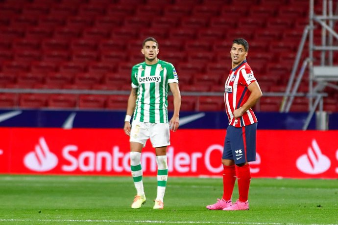 Luis Suarez of Atletico de Madrid and Marc Bartra of Real Betis in action during the spanish league, La Liga, football match played between Atletico de Wanda Metropolitano stadium on October 24, 2020 in Madrid, Spain.