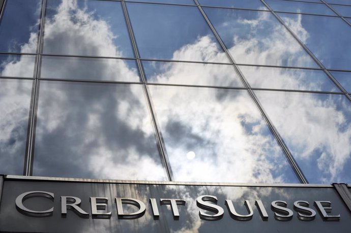 FILED - 14 July 2010, Hessen, Frankfurt_Main: A general view of the Credit Suisse bank logo placed onto the main entrance of the bank's branch in Frankfurt. Credit Suisse expects to get by with fewer staff in coming years as automation kicks off, Chief 