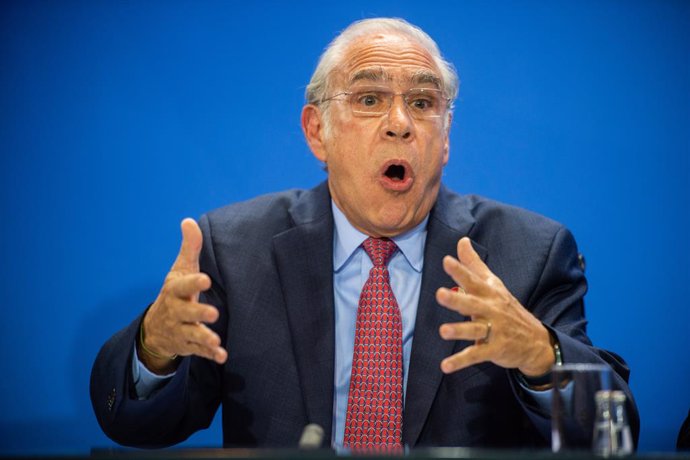 01 October 2019, Berlin: Angel Gurria, Secretary-General of the Organisation for Economic Co-operation and Development (OECD) speaks at a press conference, after German Chancellor Angela Merkel and the chairmen of international economic and financial or