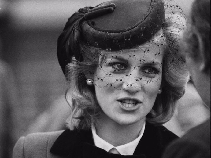 Diana, Princess of Wales (1961 - 1997), holds a bouquet of flowers during a visit to The Royal School for the Blind in Liverpool, UK, 4th December 1984.