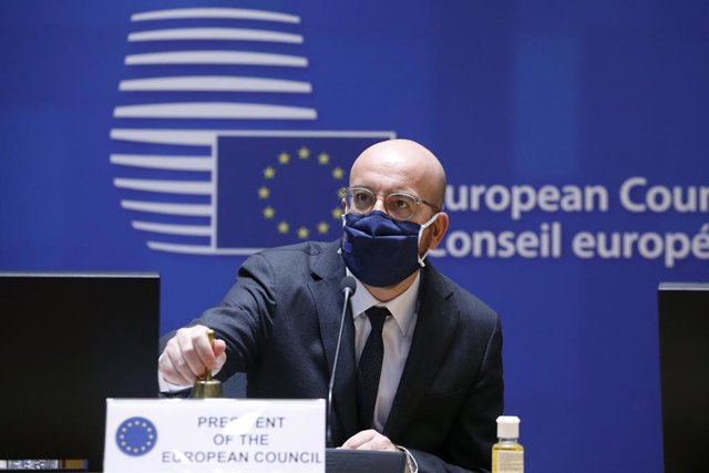 HANDOUT - 10 December 2020, Belgium, Brussels: EU Council President Charles Michel ringes a bell to start the first day of a two days face-to-face European Council summit. Photo: Dario Pignatelli/EU Council/dpa - ATTENTION: editorial use only and only if 
