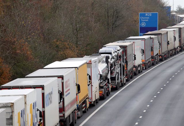 11 December 2020, England, Folkestone: Lorries queue to access the Eurotunnel site near Folkestone in Kent due to high volumes of freight traffic. The clock ticks down on the chance for the UK to strike a deal before the end of the Brexit transition per