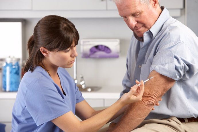 Doctor Giving Male Patient Injection