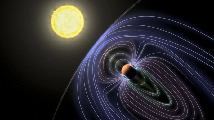 En esta representación artística del sistema Tau Botes b, las líneas que representan el campo magnético invisible se muestran protegiendo al planeta Júpiter caliente del viento solar.