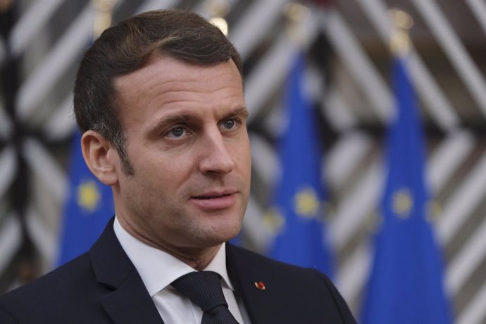 HANDOUT - 10 December 2020, Belgium, Brussels: French President Emmanuel Macron speaks to media as he arrives for the first day of a two days face-to-face European Council summit. Photo: Alexandros Michailidis/EU Council/dpa - ATTENTION: editorial use o