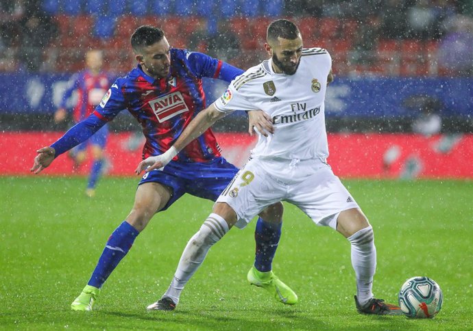 Karim Benzema, player of Real Madrid from France,  and Edu Exposito, player of Eibar from Spain, fight for the ball during the spanish league La Liga football match played between SD Eibar and Real Madrid CF  at Municipal de Ipurua Stadium on November 0