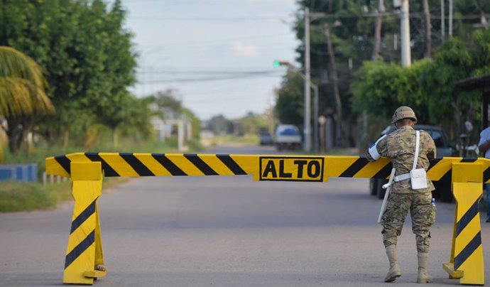 31 May 2020, Bolivia, Trinidad: A soldier guards a road barrier on an empty road amid a five-day curfew imposed to curb the spreading of coronavirus. Photo: Diego Valero/ABI/dpa