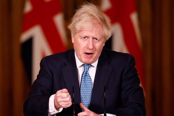 21 December 2020, England, London: UK Prime Minister Boris Johnson speaks during a press conference in response to the ongoing situation with the coronavirus (Covid-19) pandemic at 10 Downing Street. Photo: Tolga Akmen/PA Wire/dpa
