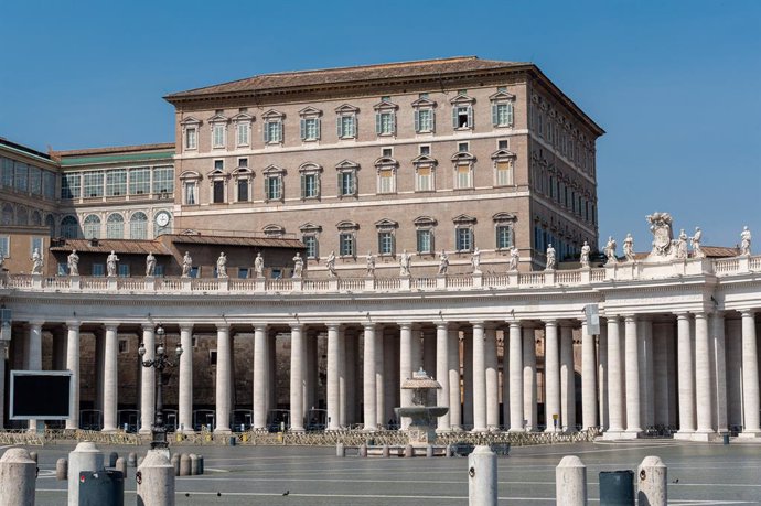 March 22, 2020 - Vatican City, Vatican:  Pope Francis looks out the window of the Apostolic Palace, after the television broadcast of the noon Angelus prayer, in a completely empty St. Peter's Squar, due to the government restrictions of the Covid19 epi