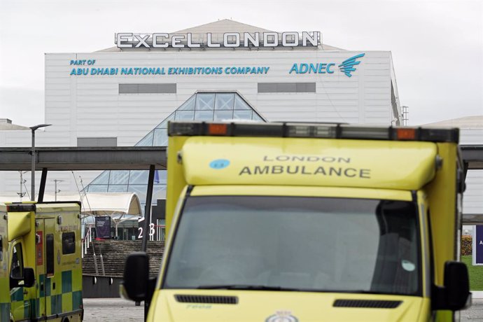 02 January 2021, England, London: Ambulances are seen parked outside the ExCeL in east London which is the site of one of a number of Nightingale hospitals prepared last year at the start of the coronavirus pandemic and which the NHS says is being react
