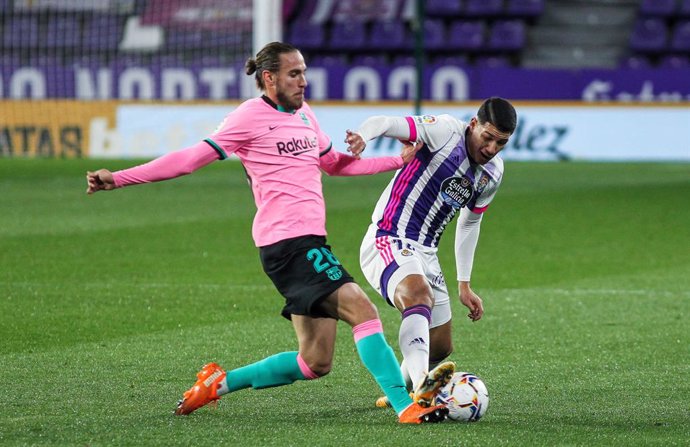 Oscar Mingueza of FC Barcelona and Marcos Andre of Real Valladolid fight for the ball during La Liga football match played between Real Valladolid and FC Barcelona at Jose Zorrilla stadium on December 22, 2020 in Valladolid, Spain.