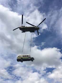 dpatop - HANDOUT - 19 June 2020, US, ---: A National Guard Chinook helicopter  lifts an abandoned bus, made famous by the book and movie "Into the Wild," from the remote Stampede Trail. Photo: ---/Alaska Department of Natural Resources/dpa