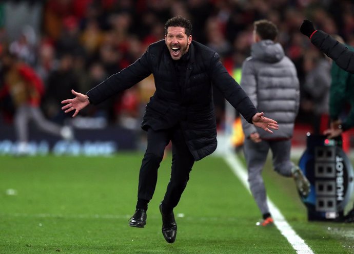 11 March 2020, England, Liverpool: Atletico Madrid's manager Diego Simeone celebrates after Marcos Llorente (not pictured) scored his side's second goal during the UEFA Champions League round of 16 second leg soccer match between Liverpool and Atletico 