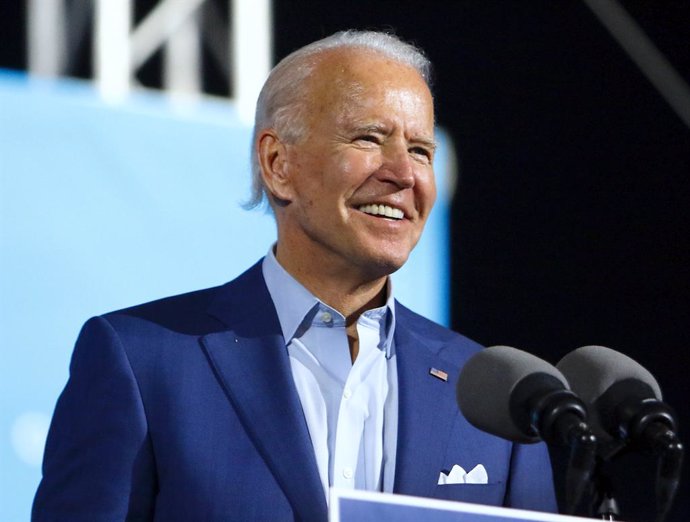 FILED - 29 October 2020, US, Tampa: USDemocratic candidate for president Joe Biden speaks to a crowd of supporters during a drive-in rally at the Florida State Fairgrounds. Former vice president Biden is projected to win the White House, bringing an en
